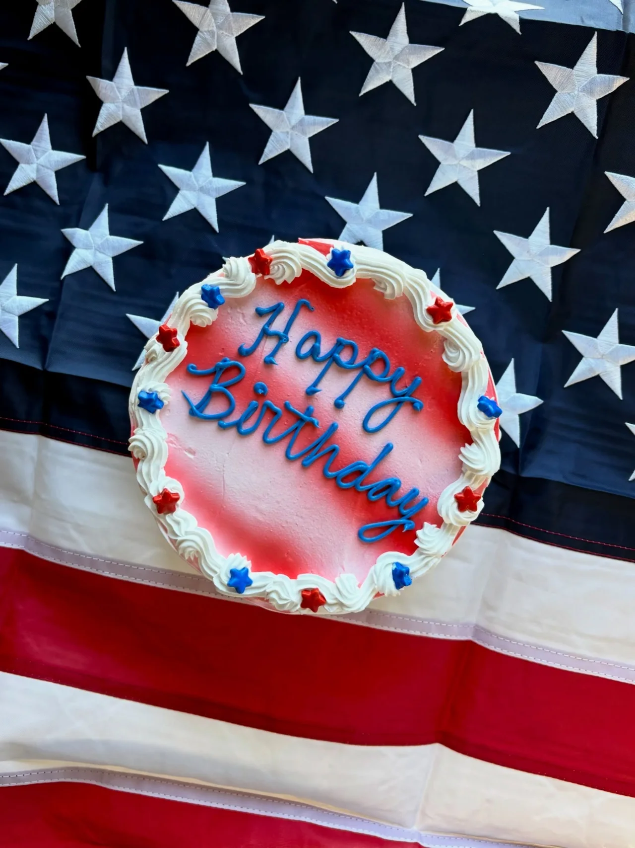 A Fourth of July ice cream cake on an American flag