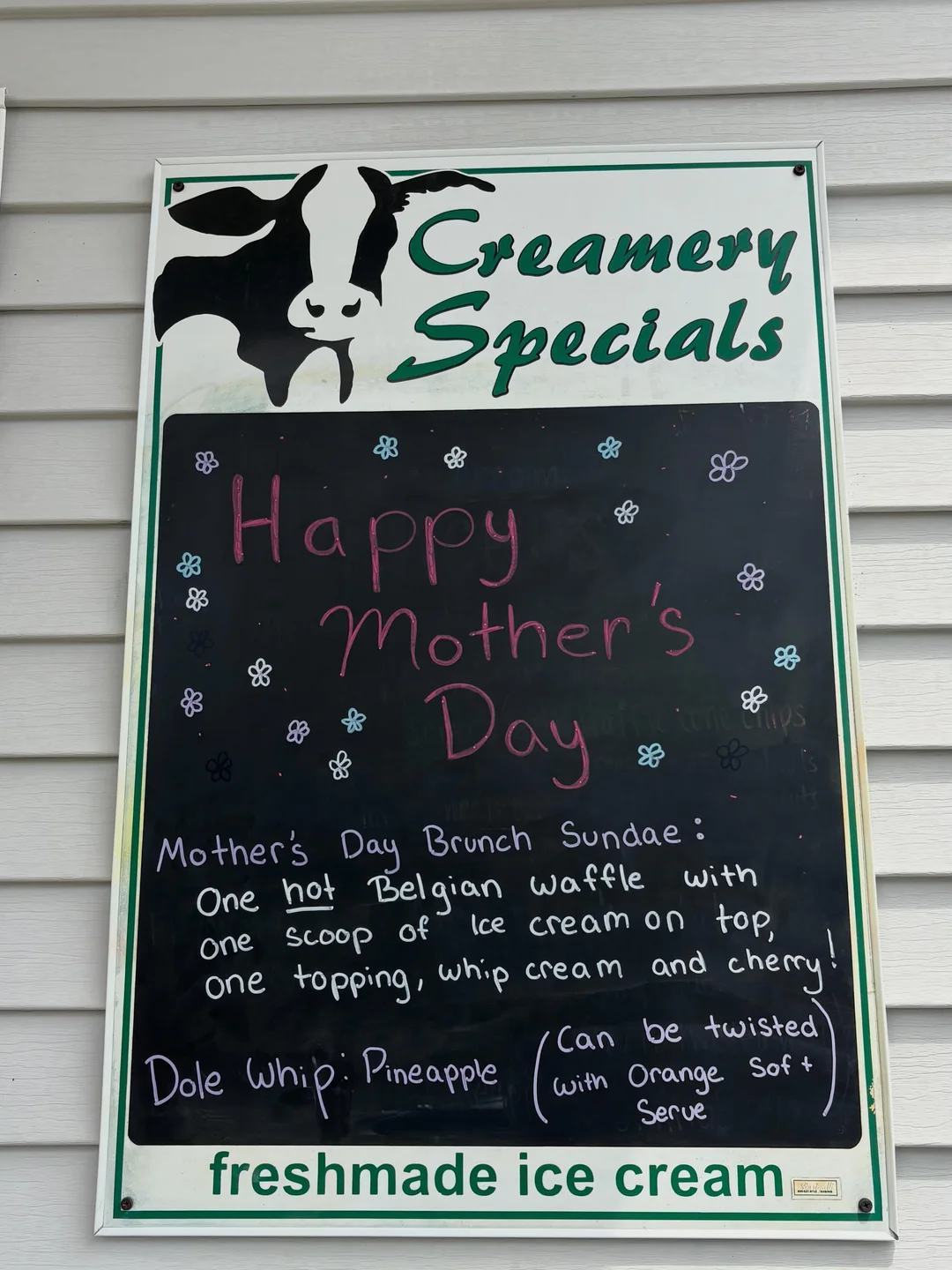 The Creamery Specials chalkboard at the window